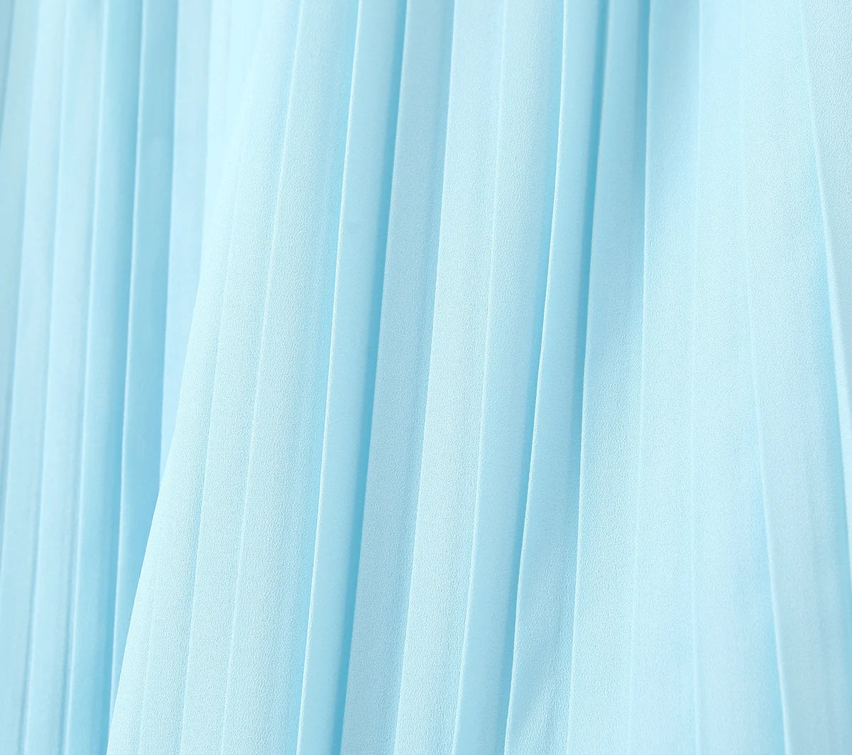 one-shoulder dress with pleated skirt