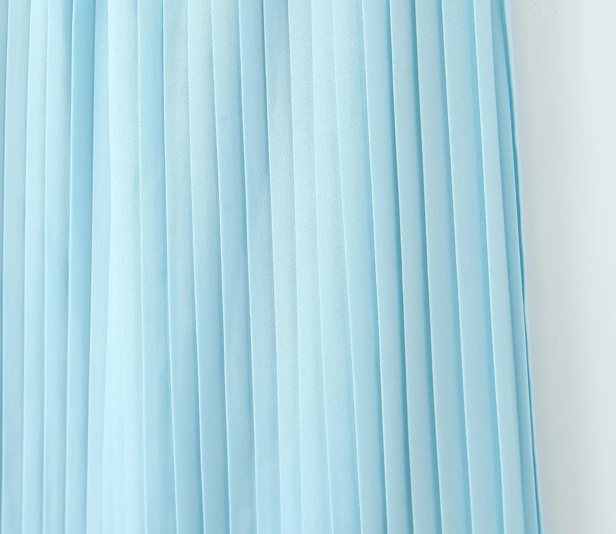 one-shoulder dress with pleated skirt