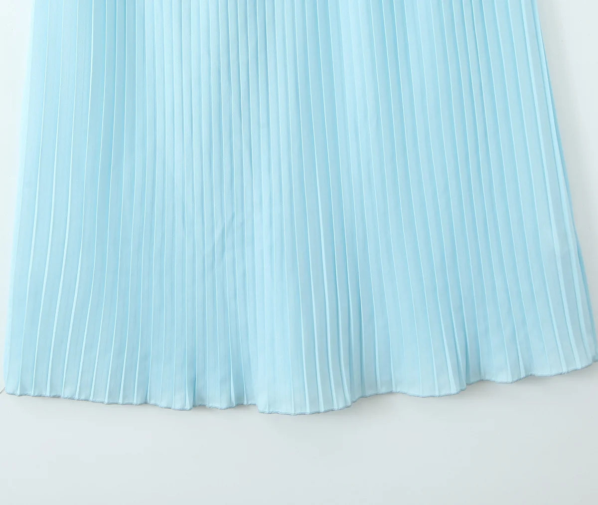 one-shoulder dress with pleated skirt